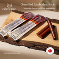 Corderro Premium Mild Heat Lamb Meat Sticks showing a close-up of spicy, flavorful lamb meat sticks on a wooden surface.