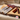Corderro Premium Lamb Meat Sticks with Mild Heat, 24 sticks, showing close-up of seasoned lamb meat snack sticks.